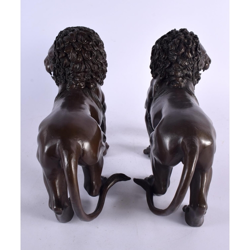 455 - A LARGE PAIR OF CONTEMPORARY BRONZE LIONS. 24 cm x 30 cm.