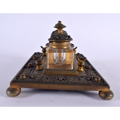 464 - AN ANTIQUE FRENCH BRONZE INKWELL decorated with motifs. 21 cm x 10 cm.