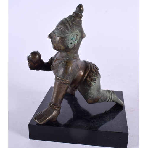 466 - A 19TH CENTURY INDIAN BRONZE FIGURE OF A BUDDHISTIC MALE modelled crawling. 13 cm x 7 cm.