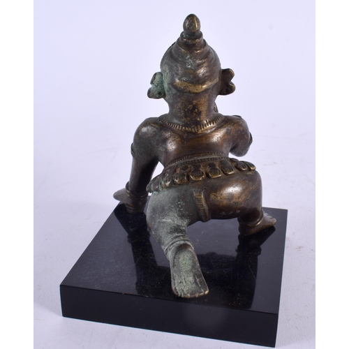 466 - A 19TH CENTURY INDIAN BRONZE FIGURE OF A BUDDHISTIC MALE modelled crawling. 13 cm x 7 cm.