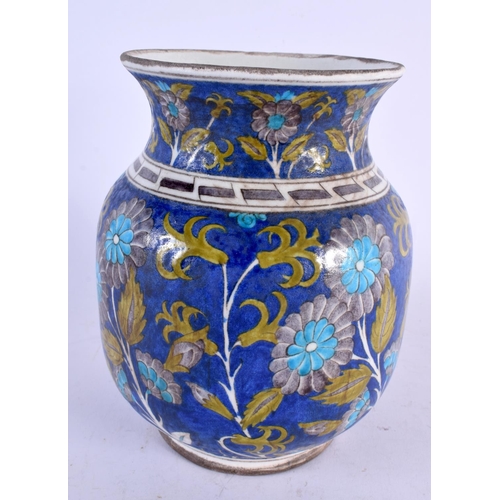 467 - A TURKISH MIDDLE EASTERN IZNIK VASE painted with flowers. 20 cm x 14 cm.