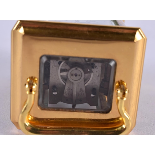 469 - A CONTEMPORARY MINIATURE BRASS CARRIAGE CLOCK. 10 cm x 5 cm.