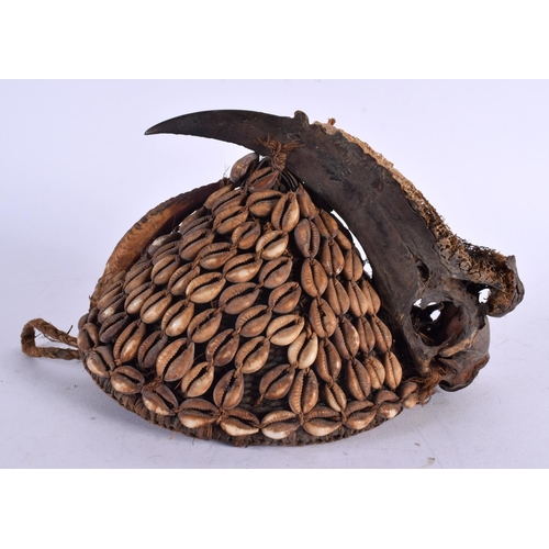 503 - AN EARLY 20TH CENTURY AFRICAN CARVED BIRD HEAD CONCH SHELL HAT possibly Lega. 21 cm x 15 cm.