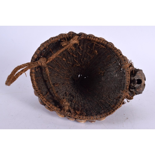 503 - AN EARLY 20TH CENTURY AFRICAN CARVED BIRD HEAD CONCH SHELL HAT possibly Lega. 21 cm x 15 cm.