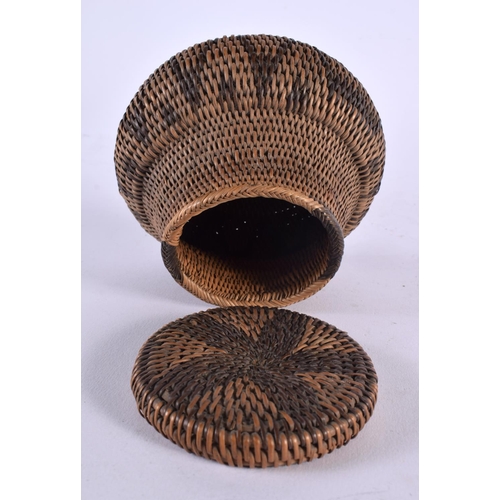 509 - AN EARLY 20TH CENTURY TRIBAL CARVED WICKER WORK ROTI BASKET. 12 cm x 10 cm.