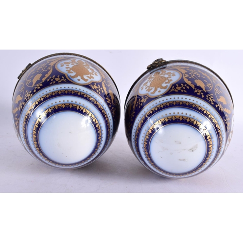 51 - A PAIR OF EARLY 20TH CENTURY FRENCH BRONZE AND PORCELAIN EGGS probably Limoges in the Sevres style. ... 