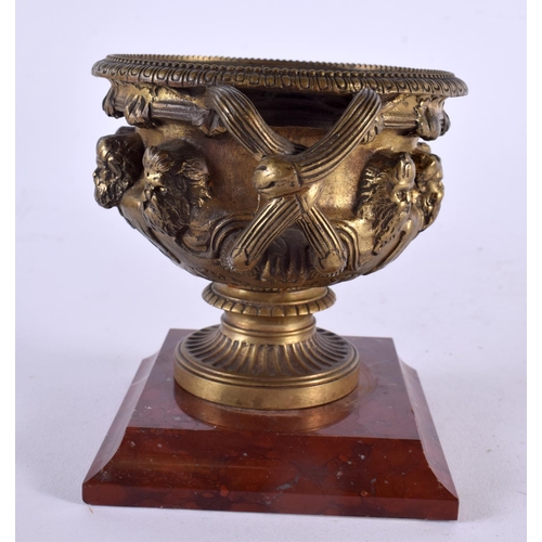 510 - A MID 19TH CENTURY EUROPEAN TWIN HANDLED GRAND TOUR BRONZE WARWICK VASE upon a marble base. 14 cm x ... 