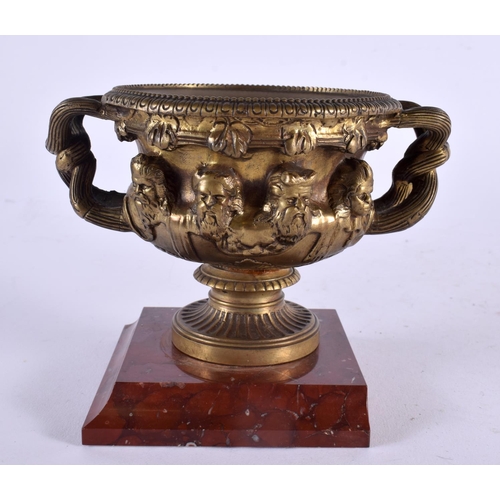 510 - A MID 19TH CENTURY EUROPEAN TWIN HANDLED GRAND TOUR BRONZE WARWICK VASE upon a marble base. 14 cm x ... 