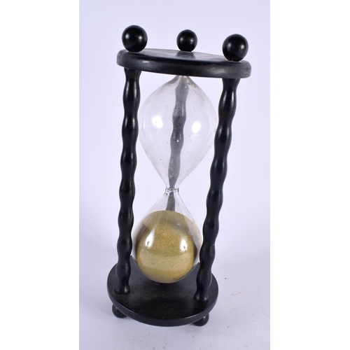 511 - A VINTAGE EBONISED WOOD SAND TIMER. 28 cm high.