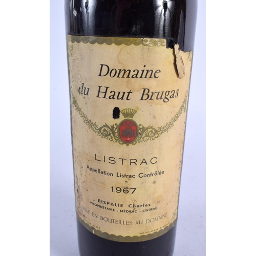 518 - A BOTTLE OF 1967 DOMAINE DU HAUT BRUGAS WINE. 30 cm high.