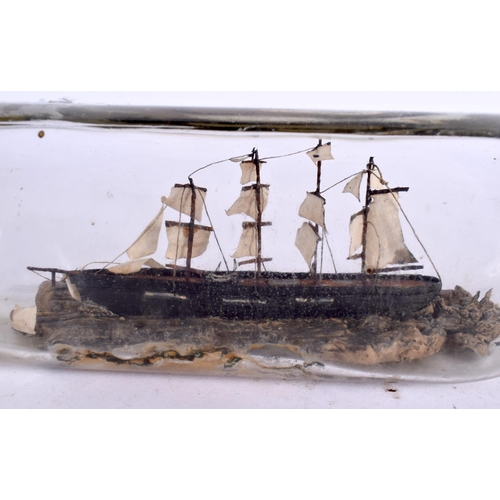 519 - A VICTORIAN SHIP IN A GLASS BOTTLE. 23 cm wide.