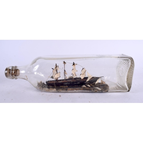 519 - A VICTORIAN SHIP IN A GLASS BOTTLE. 23 cm wide.