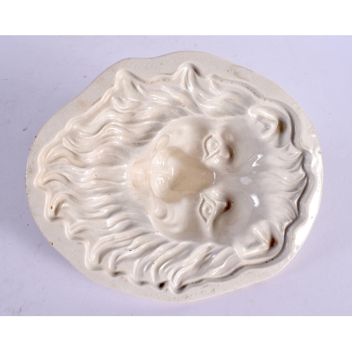 52 - THREE 19TH CENTURY ENGLISH CREAMWARE JELLY MOULDS including an unusual lion example. Largest 16 cm x... 