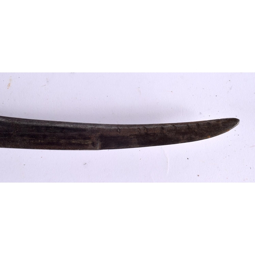 527 - AN ANTIQUE MIDDLE EASTERN KNIFE with white metal and brass scabbard. 38 cm long.