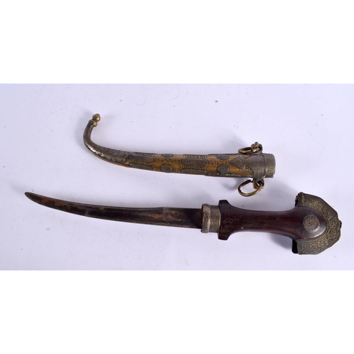 527 - AN ANTIQUE MIDDLE EASTERN KNIFE with white metal and brass scabbard. 38 cm long.