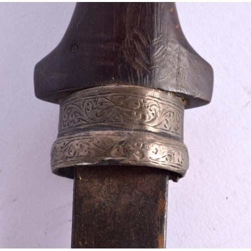 527 - AN ANTIQUE MIDDLE EASTERN KNIFE with white metal and brass scabbard. 38 cm long.