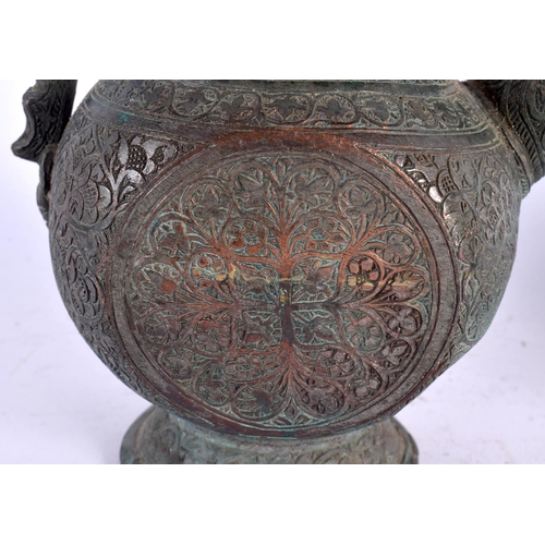 528 - A PAIR OF 19TH CENTURY MIDDLE EASTERN BRONZED COPPER EWERS decorated with foliage and vines. 32 cm x... 