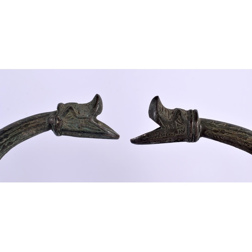 528 - A PAIR OF 19TH CENTURY MIDDLE EASTERN BRONZED COPPER EWERS decorated with foliage and vines. 32 cm x... 