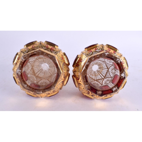 54 - A FINE PAIR OF 19TH CENTURY BOHEMIAN RUBY AND GILT GLASS SCENT BOTTLES painted with motifs. 13 cm x ... 