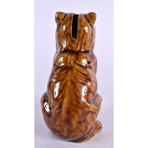 541 - AN UNUSUAL ANTIQUE TREACLE GLAZED MONEY BOX. 14 cm x 5 cm.