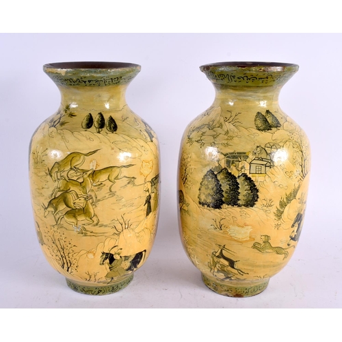 546 - A PAIR OF 19TH CENTURY PERSIAN MIDDLE EASTERN LACQUERED VASES painted with deer and figures. 28 cm x... 