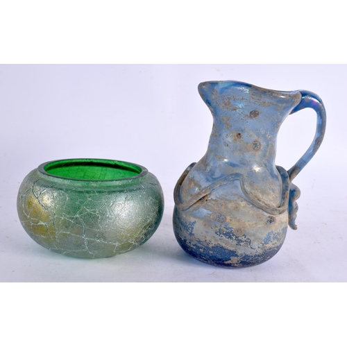 55 - TWO IRIDESCENT GLASS VASES together with a jug and bowl. Largest 13 cm high. (4)