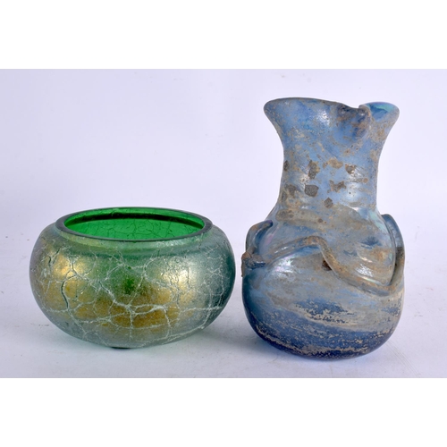 55 - TWO IRIDESCENT GLASS VASES together with a jug and bowl. Largest 13 cm high. (4)