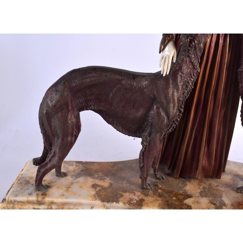 551 - A VERY LARGE FRENCH ART DECO COLD PAINTED BRONZE FIGURE modelled as a female beside borzoi dogs. 55 ... 