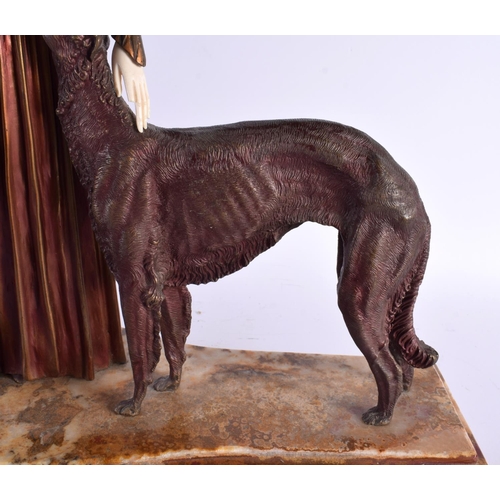 551 - A VERY LARGE FRENCH ART DECO COLD PAINTED BRONZE FIGURE modelled as a female beside borzoi dogs. 55 ... 