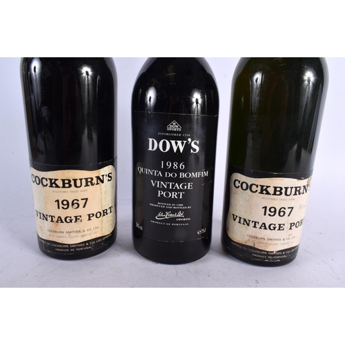 553 - TWO BOTTLES OF 1967 COCKBURNS PORT together with a 1986 Dows Quinta Do Bomfim port. (3)