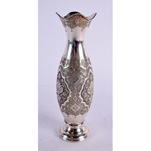 559 - A PERSIAN MIDDLE EASTERN SILVER VASE. 226 grams. 21 cm high.