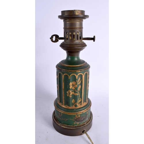 563 - AN ANTIQUE TOLEWARE OIL LAMP together with rare antique painted tin tea caddy. Largest 33 cm x 10 cm... 