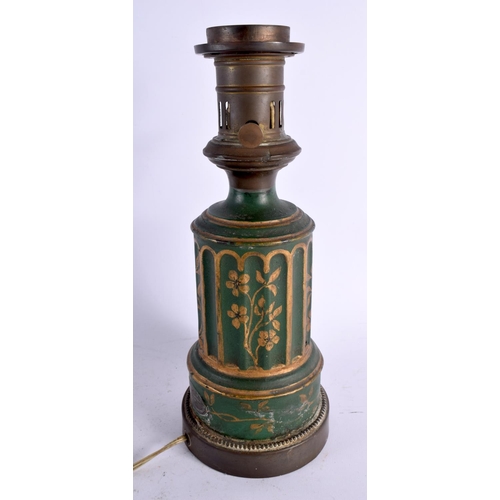 563 - AN ANTIQUE TOLEWARE OIL LAMP together with rare antique painted tin tea caddy. Largest 33 cm x 10 cm... 