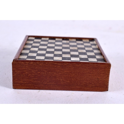 569 - AN UNUSUAL ANTIQUE POCKET SIZE MINIATURE GAMING BOARD. 5.5 cm square.