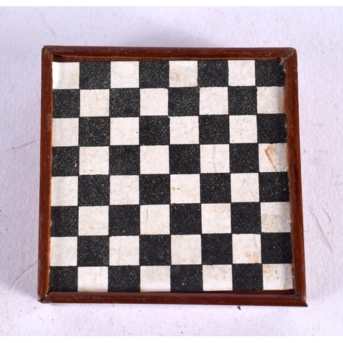 569 - AN UNUSUAL ANTIQUE POCKET SIZE MINIATURE GAMING BOARD. 5.5 cm square.