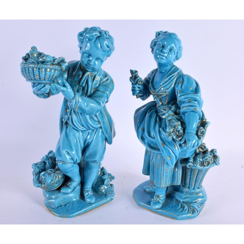 57 - A PAIR OF 19TH BLUE GLAZED PORCELAIN FIGURES OF A BOY AND GIRL Minton or Sevres, painted with gilt f... 