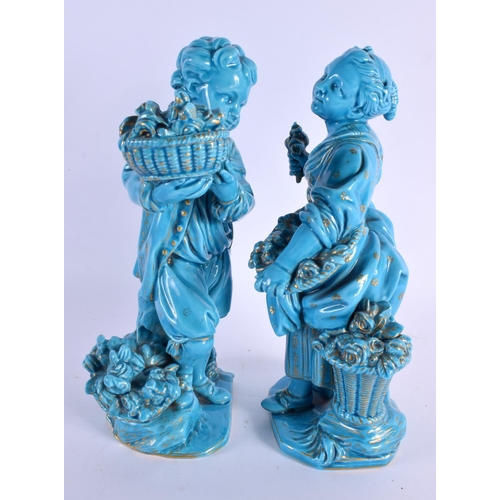 57 - A PAIR OF 19TH BLUE GLAZED PORCELAIN FIGURES OF A BOY AND GIRL Minton or Sevres, painted with gilt f... 