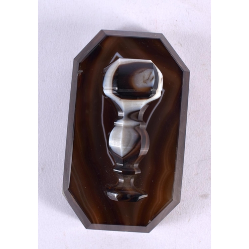 586 - AN UNUSUAL 19TH CENTURY EUROPEAN BANDED AGATE DESK PAPERWEIGHT with applied seal. 11 cm x 5 cm.