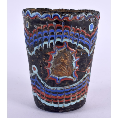 59 - A 19TH CENTURY MIDDLE EASTERN GARBI GLASS CYLINDRICAL GOBLET After the Antiquity, inset with mask he... 