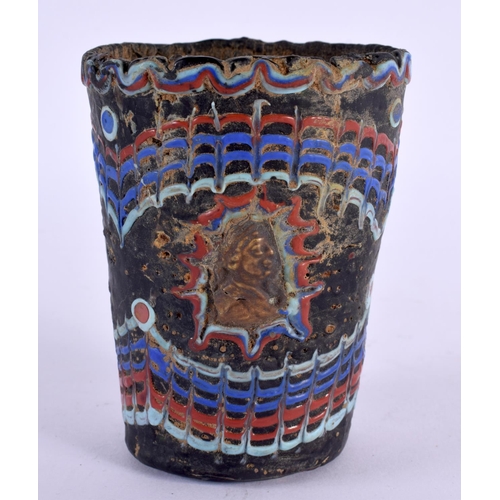 59 - A 19TH CENTURY MIDDLE EASTERN GARBI GLASS CYLINDRICAL GOBLET After the Antiquity, inset with mask he... 