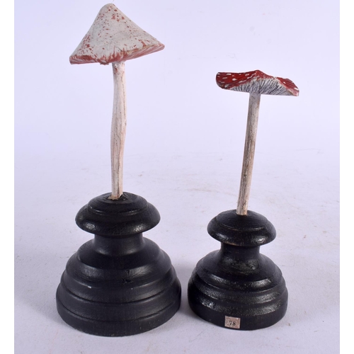 598 - TWO CARVED TAXIDERMY TYPE PAINTED FOLK ART MOUSHROOMS. Largest 15 cm high. (2)