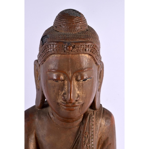 606 - AN EARLY 20TH CENTURY INDIAN LACQUERED WOOD FIGURE OF A BUDDHA. 42 cm x 28 cm.