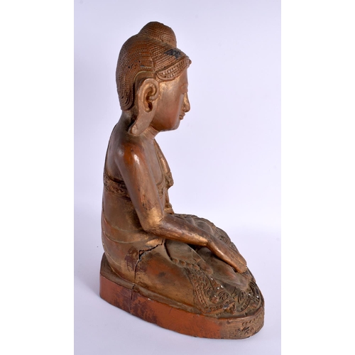 606 - AN EARLY 20TH CENTURY INDIAN LACQUERED WOOD FIGURE OF A BUDDHA. 42 cm x 28 cm.