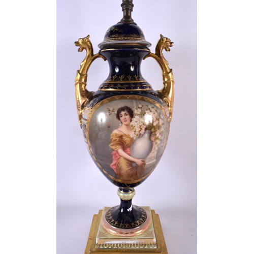 607 - A LARGE 19TH CENTURY VIENNA PORCELAIN COUNTRY HOUSE LAMP painted with a pretty female. 64 cm high.