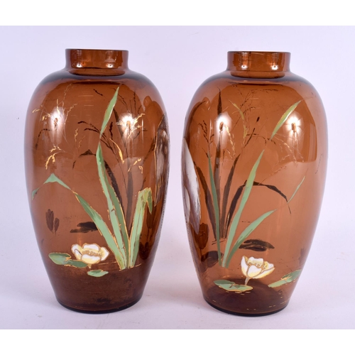 61 - A PAIR OF 19TH CENTURY EUROPEAN AESTHETIC MOVEMENT GLASS VASES enamelled with herons/cranes within l... 