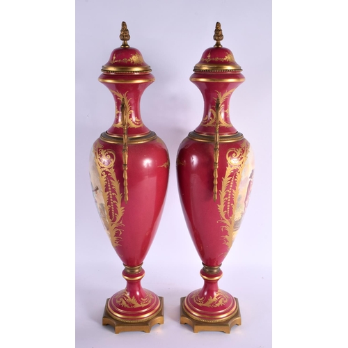 610 - A LARGE PAIR OF 19TH CENTURY FRENCH SEVRES STYLE COUNTRY HOUSE LAMPS painted with lovers within land... 