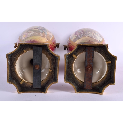 610 - A LARGE PAIR OF 19TH CENTURY FRENCH SEVRES STYLE COUNTRY HOUSE LAMPS painted with lovers within land... 