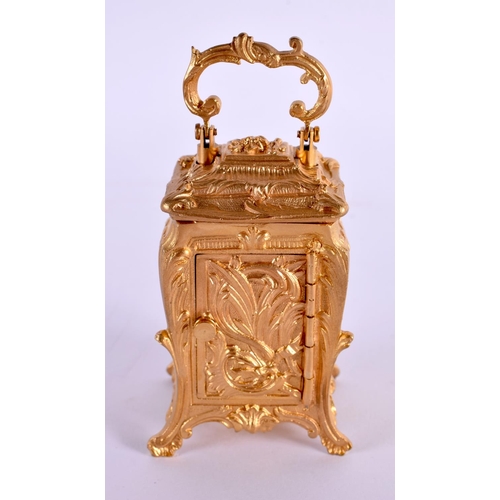 611 - A CONTEMPORARY MINIATURE BRASS ROCOCO CARRIAGE CLOCK. 9.5 cm high inc handle.