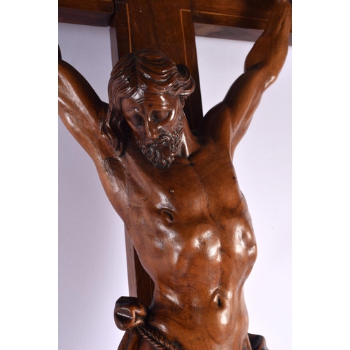 622 - A LARGE 19TH CENTURY EUROPEAN CARVED WOOD CORPUS CHRIST overlaid with a skull. 96 cm x 36 cm.