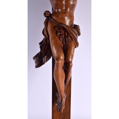 622 - A LARGE 19TH CENTURY EUROPEAN CARVED WOOD CORPUS CHRIST overlaid with a skull. 96 cm x 36 cm.